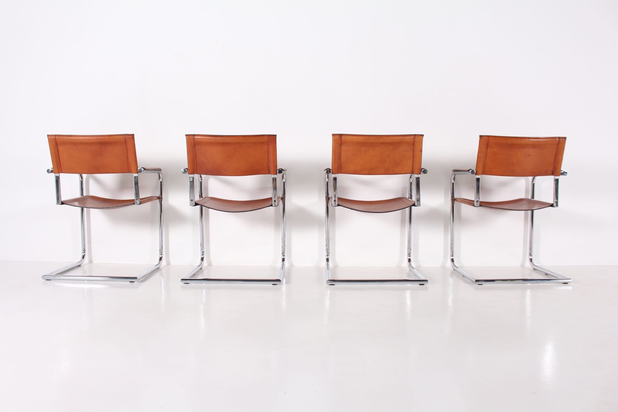 4 Matteo Grassi leather cogna cantilever armchairs