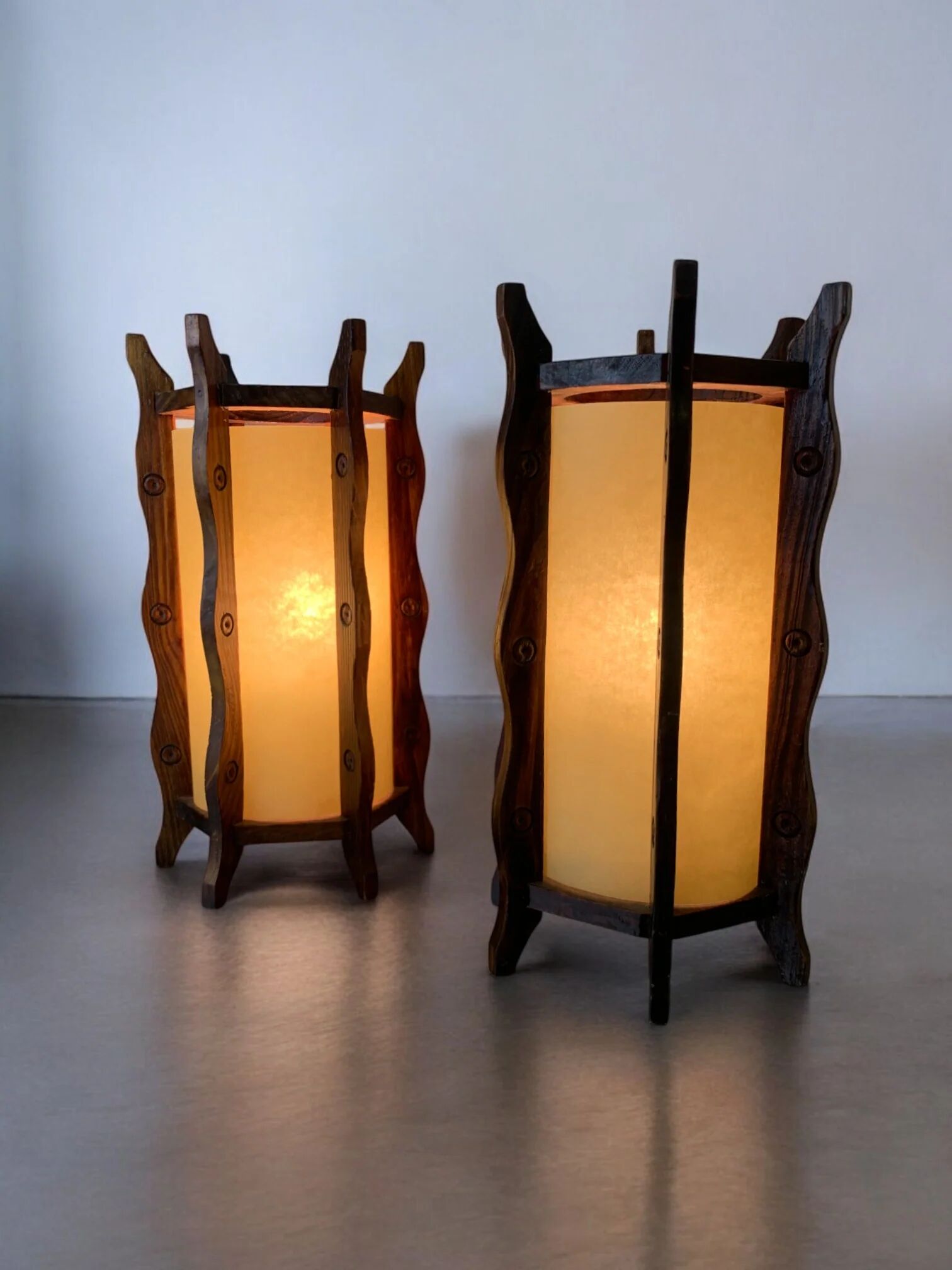 Pair of brutalist table lamps, wood & parchment, France, 1970s