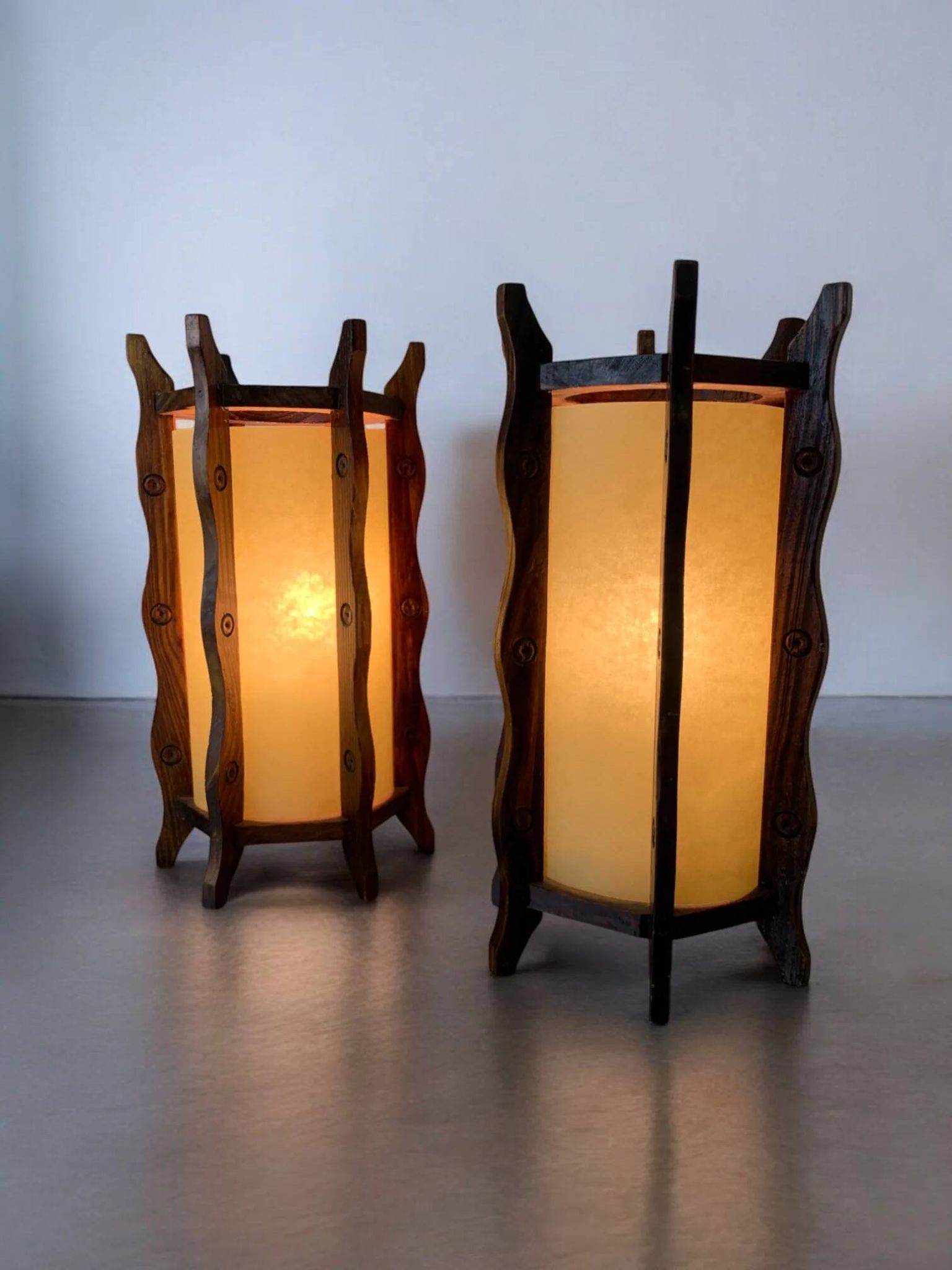 Pair of brutalist table lamps, wood & parchment, France, 1970s