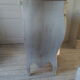 Curved patinated chest of drawers pearl grey waxed finish