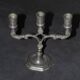 Small three-armed candlestick in pewter.