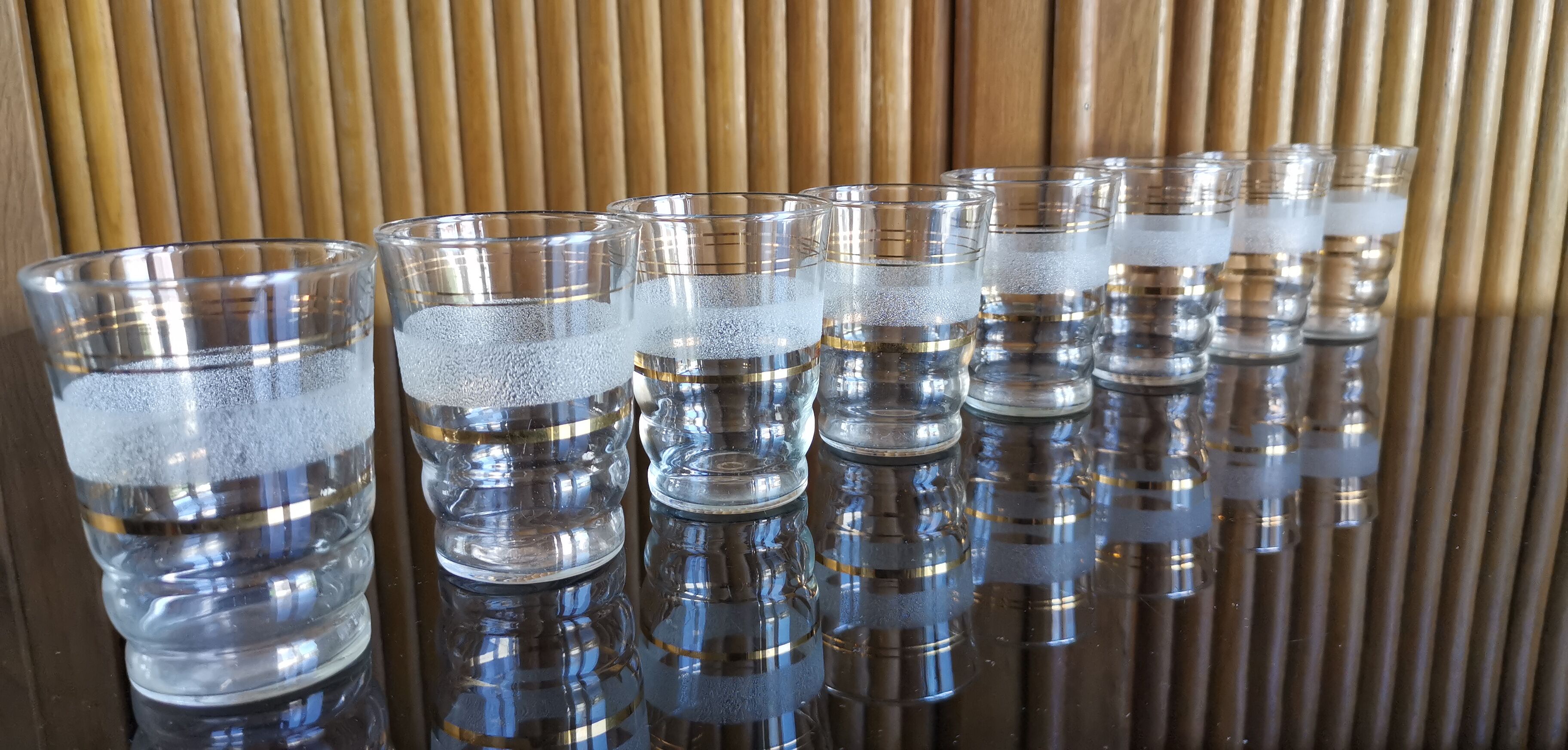 8 granite glasses bordered gold 1950s