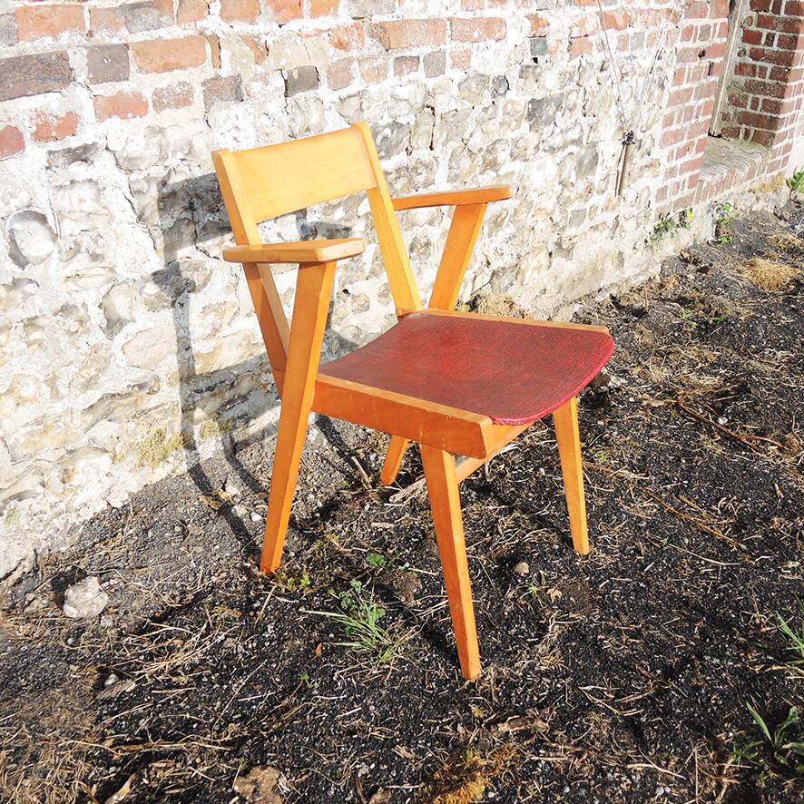 Old wooden and red leatherette bridge chair