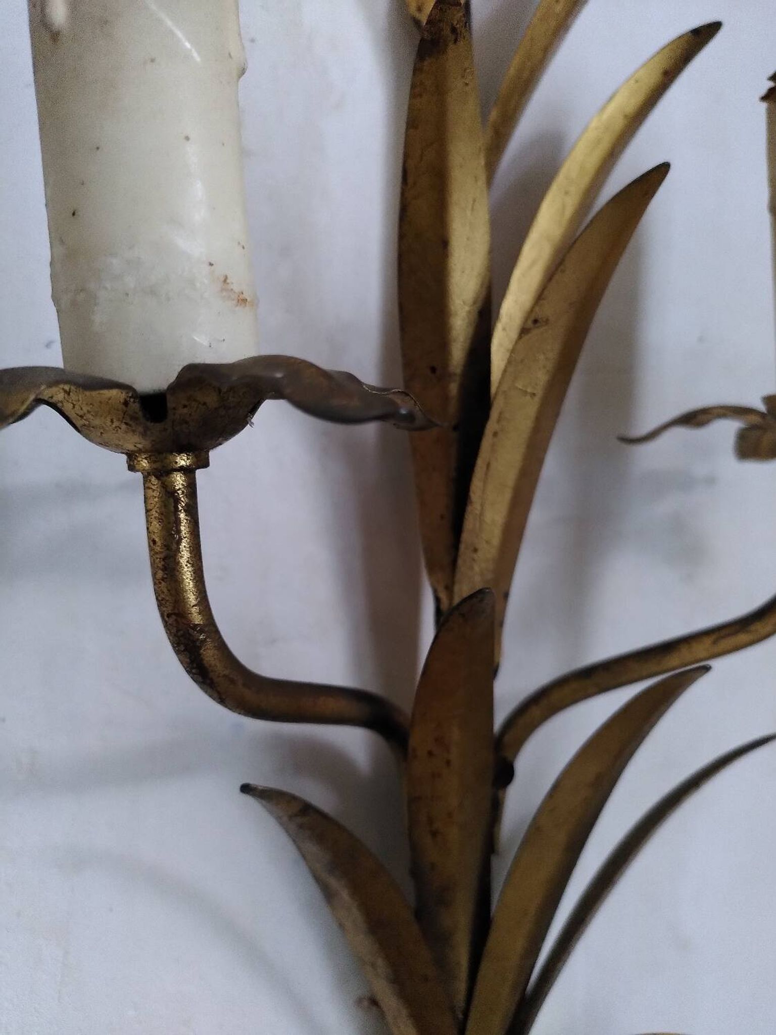 Pair of gold metal leaf wall sconces