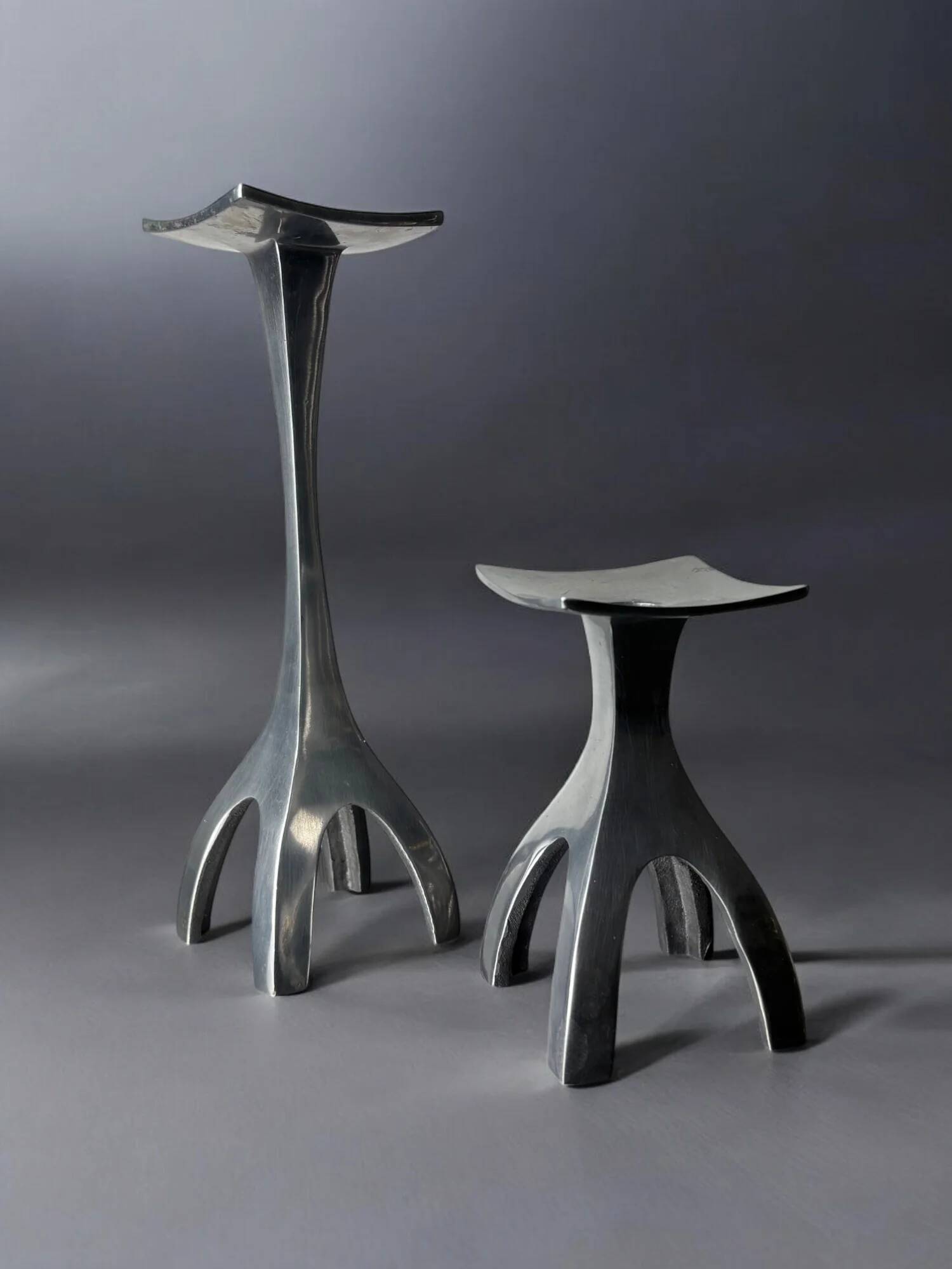 Pair of biomorphic candleholders, solid aluminium, Spain, 1970s