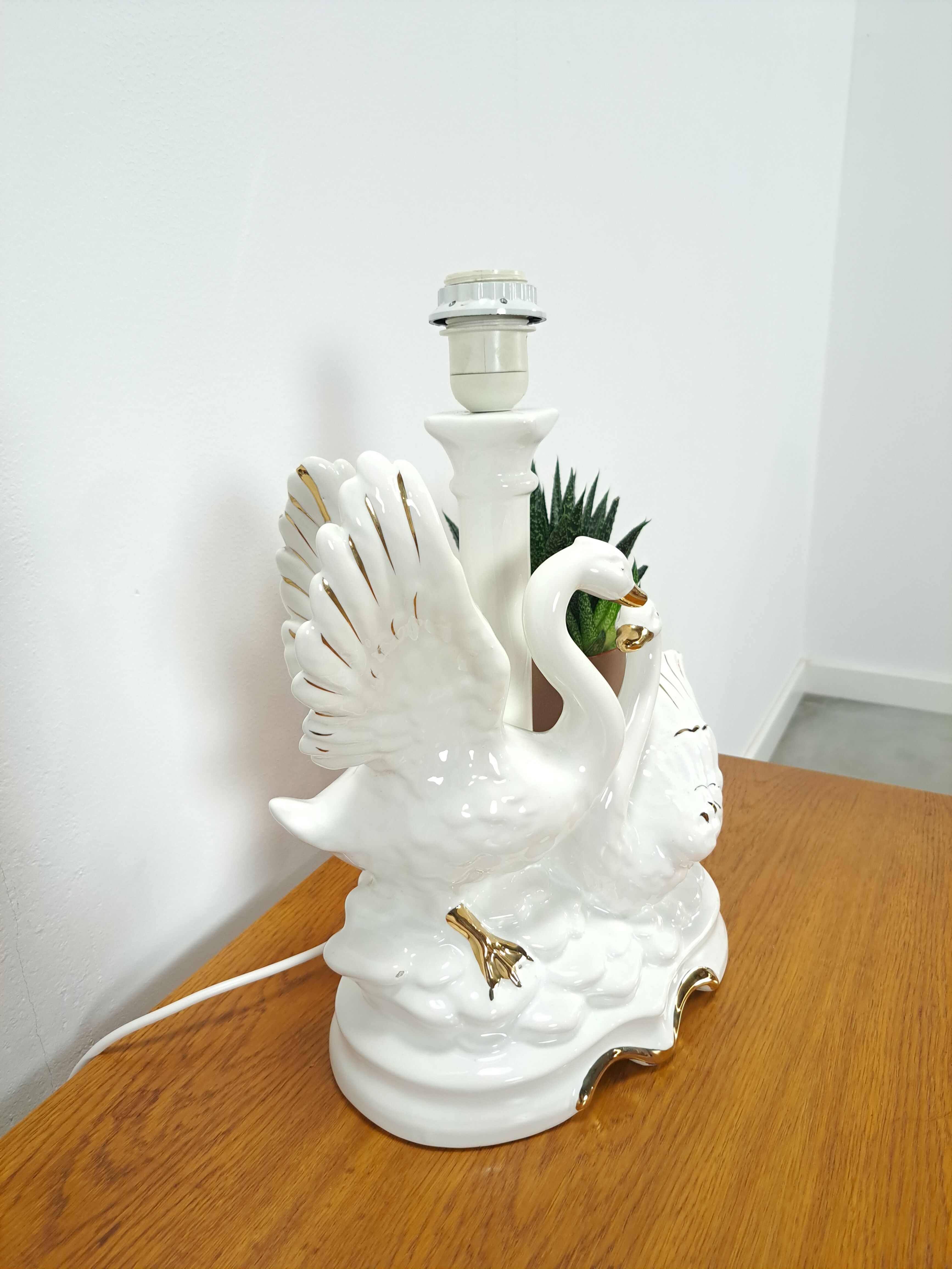 Porcelain lamp swans with vintage gold details