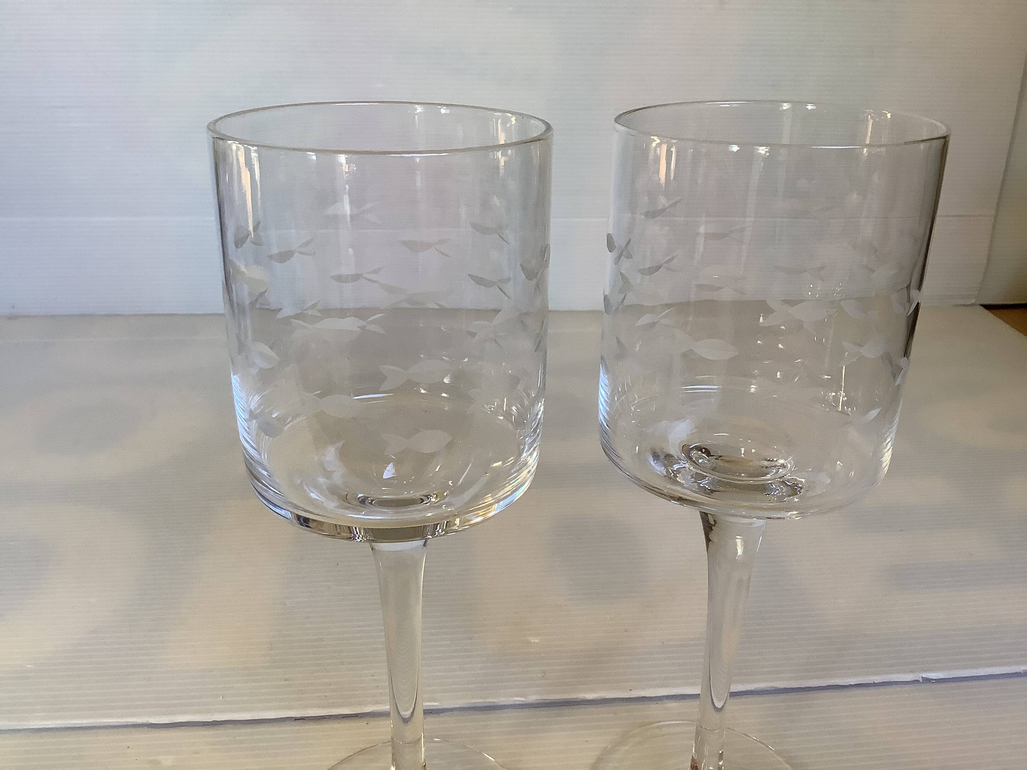 Duo of cut glass fish candle holders