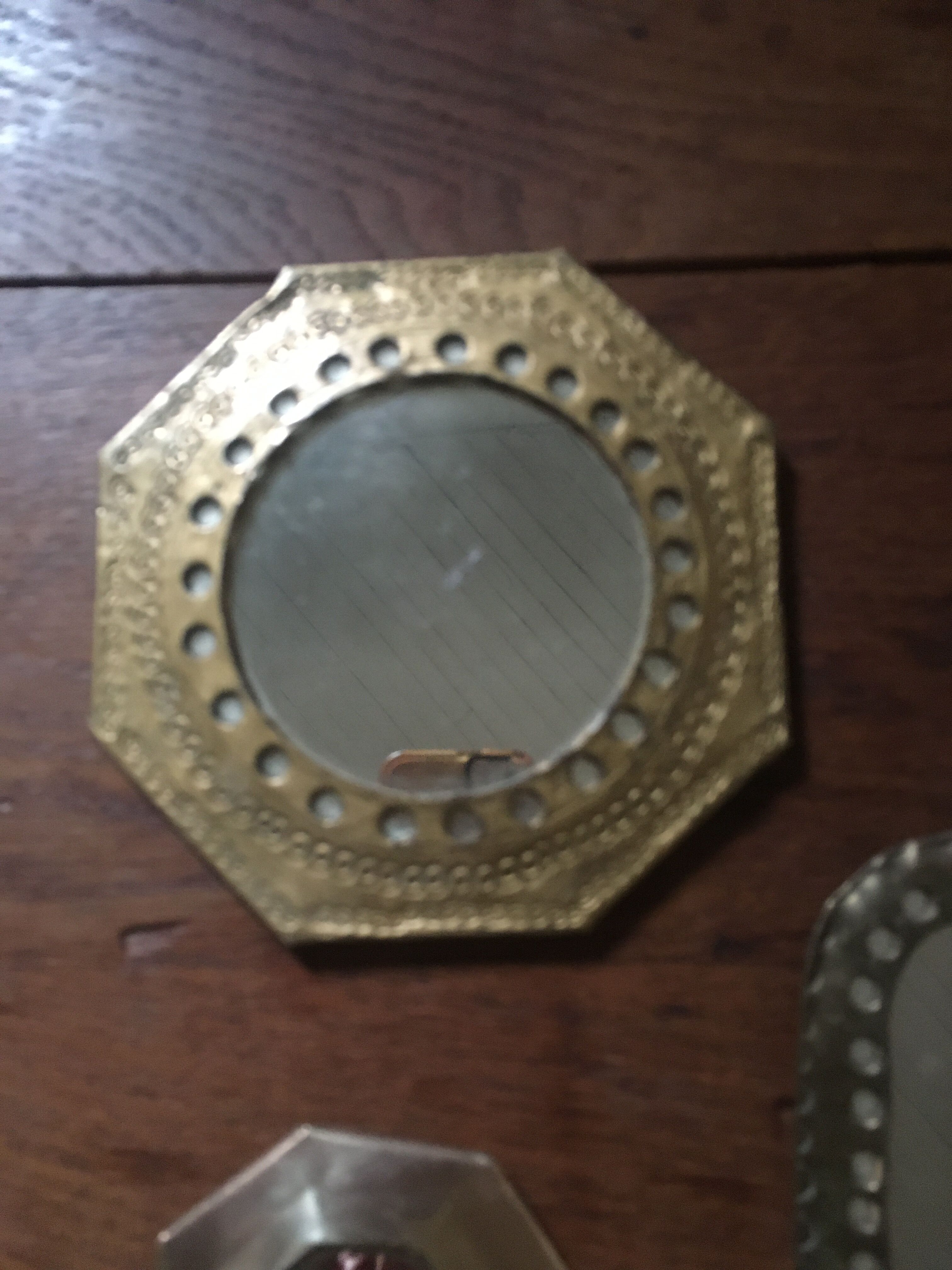 Ethnic brass mirrors.