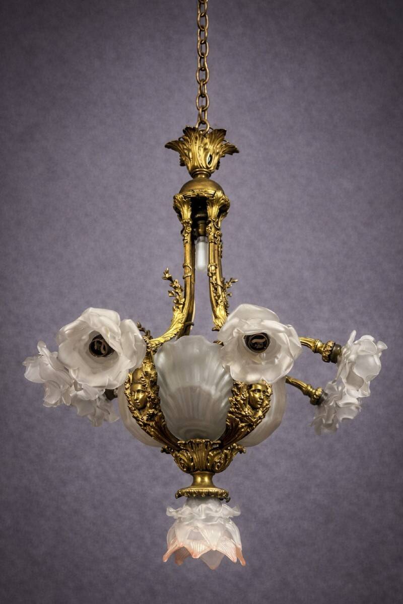 Rare and important gilded bronze chandelier with shells and roses.