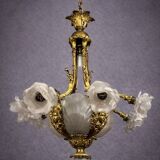 Rare and important gilded bronze chandelier with shells and roses.