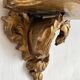 Antique wall console in wood and gilded stucco.