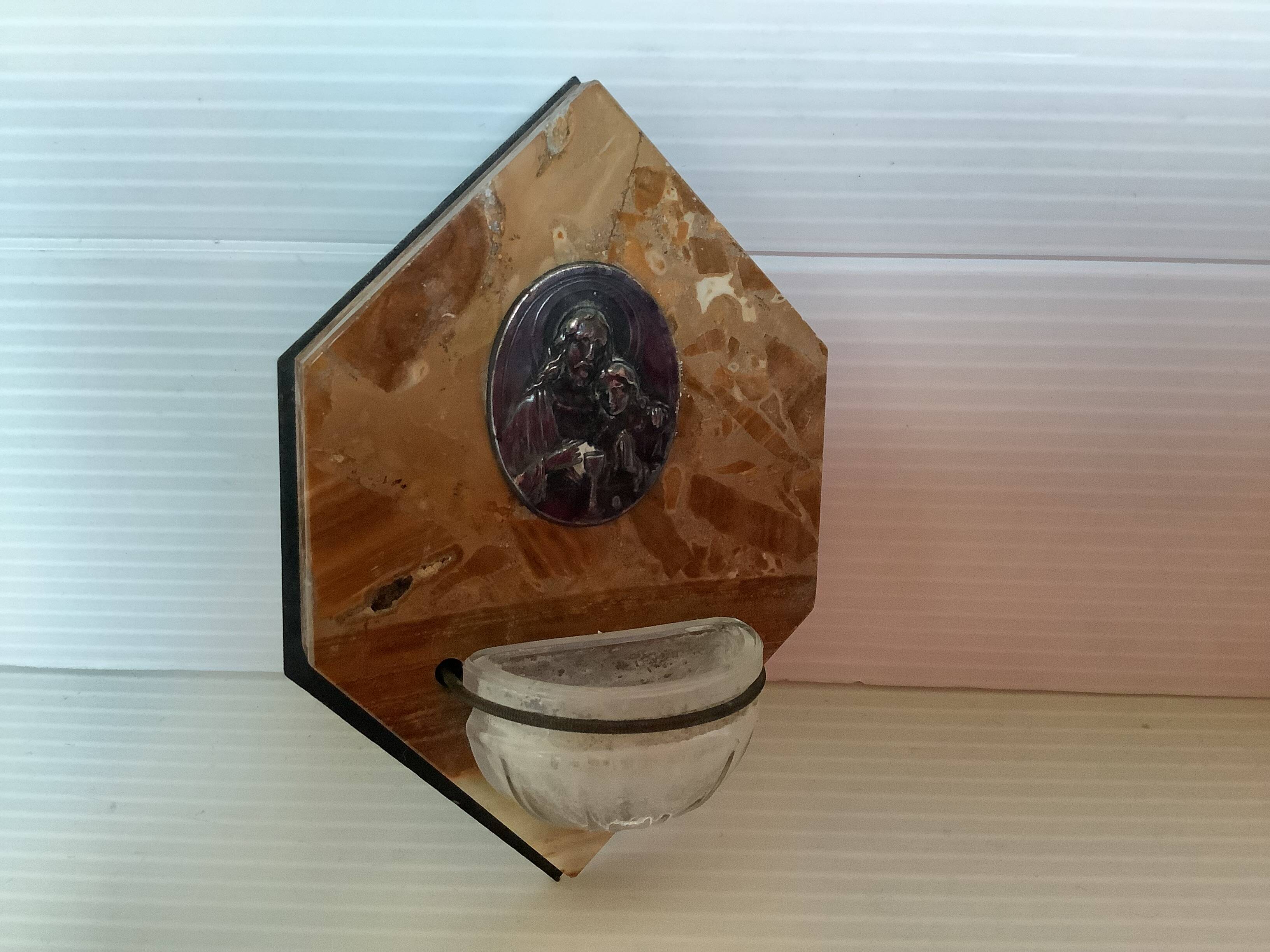 Ancient marble holy water font