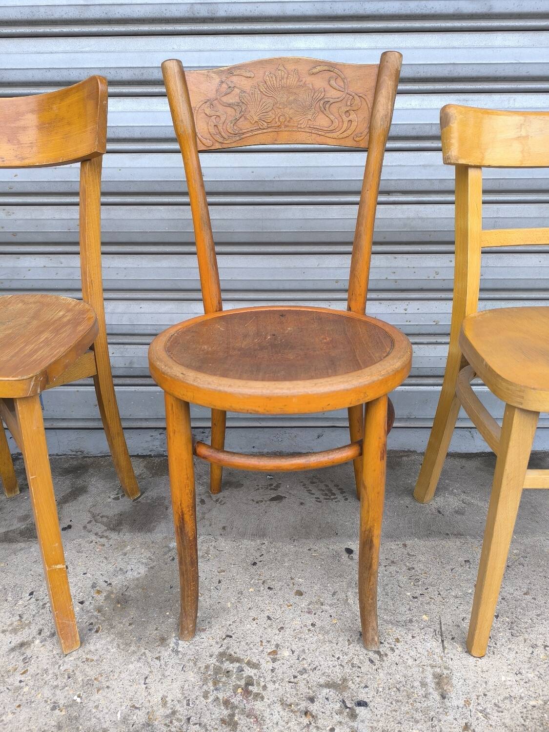 Set of four mismatched bistro chairs