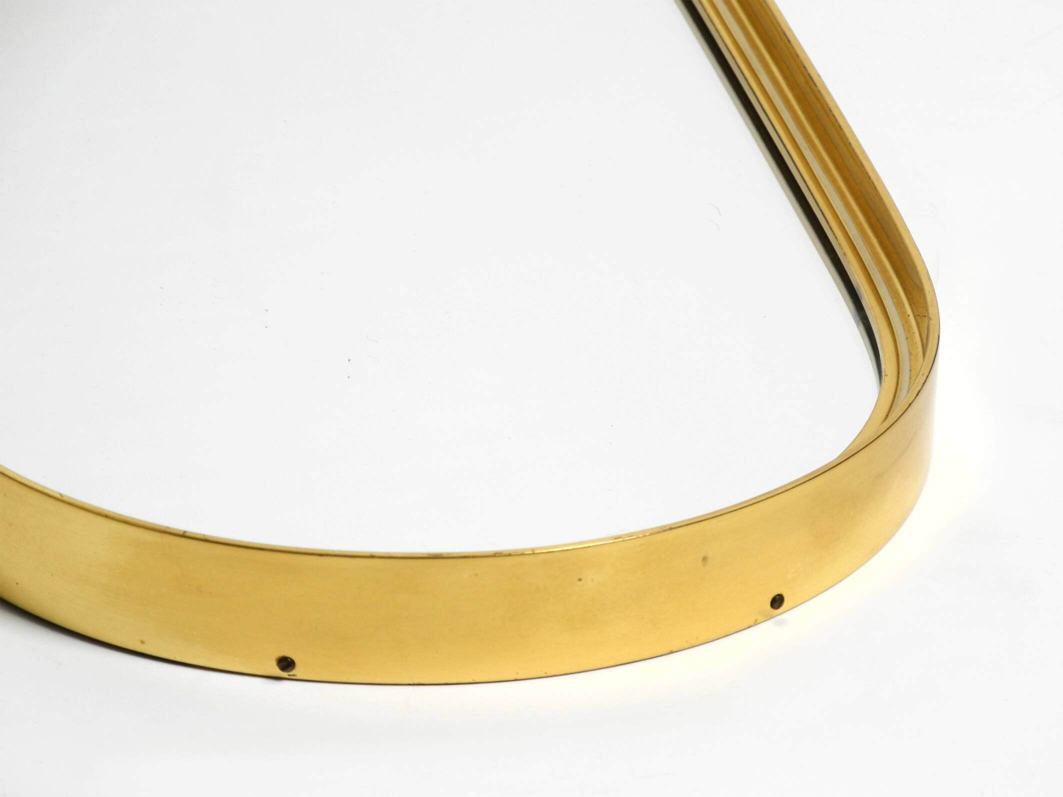 Small solid Mid Century brass wall mirror by Münchener Zierspiegel