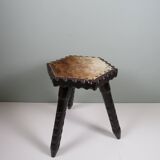 Vintage Spanish stool in carved wood with a leather seat.