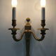 Old pair of bronze double fire wall sconces, signed md