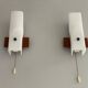 Mid-century wall lights in white plexiglass with a wooden base, 1960s, Germany.