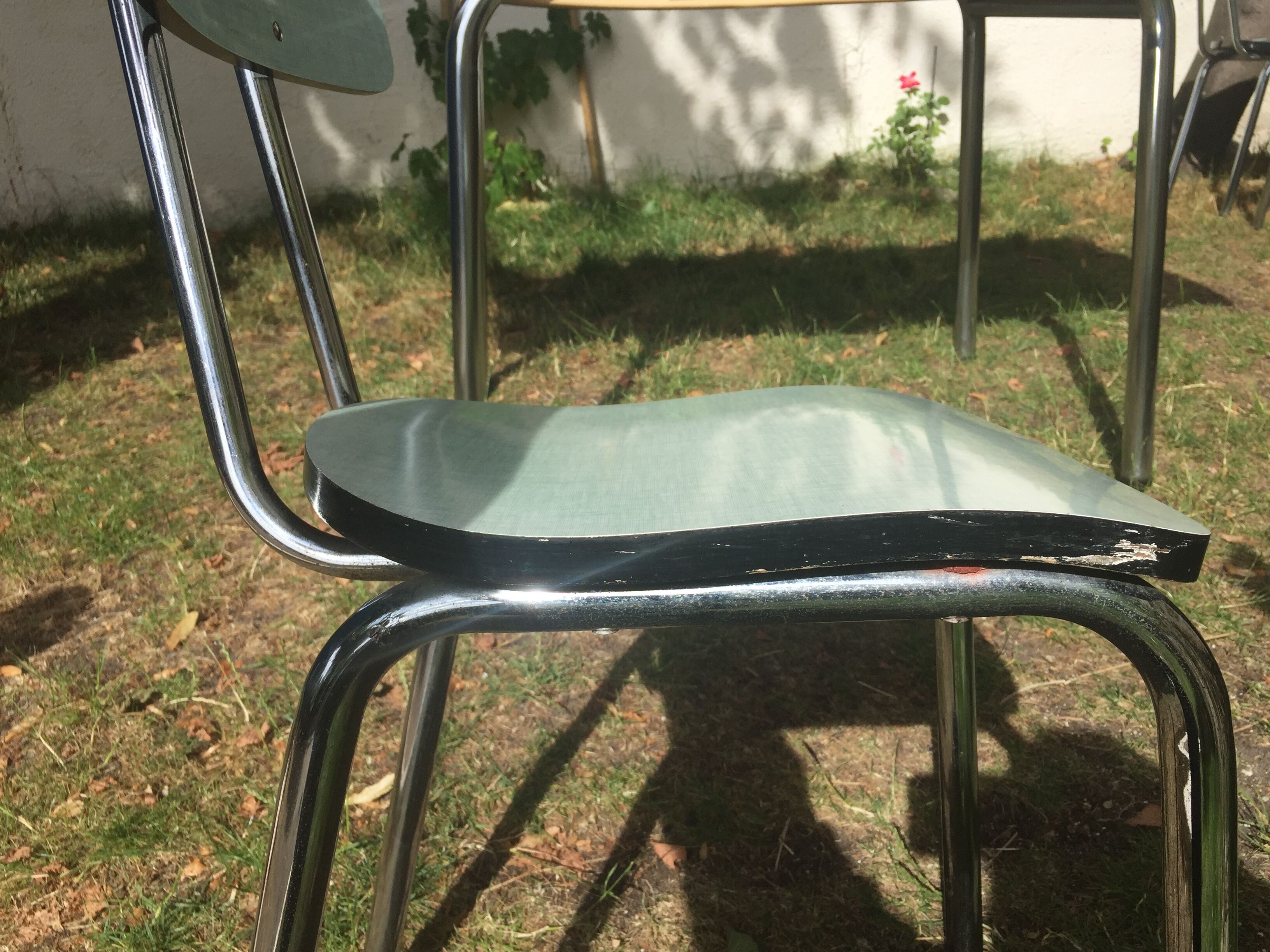 Table and 4 green water formica chairs 60's