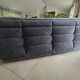 Togo canapé 3 places ligne roset avec un pouf