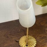 Gold metal wall light with ribbed glass.