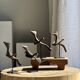 Traditional Indonesian decorative wooden bird on a base, crest model.