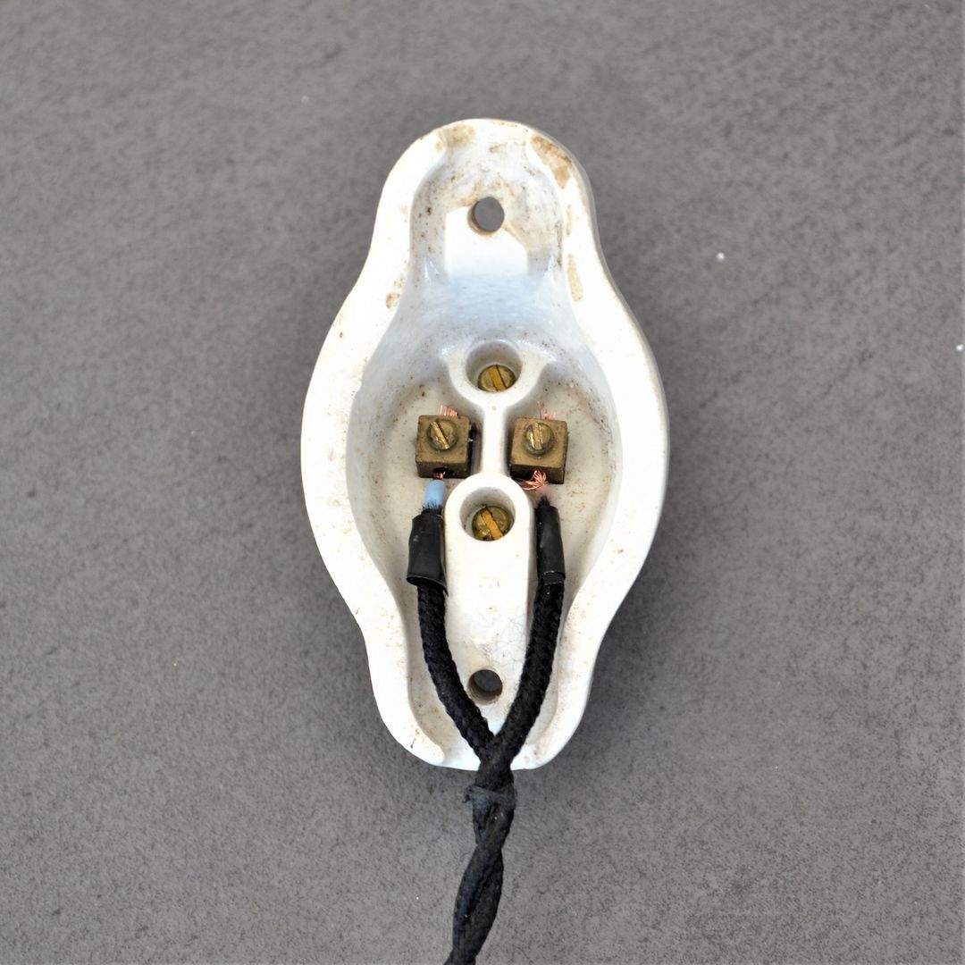 Oval porcelain hook to plug into socket
