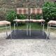 Vintage chairs and stools with chrome-plated square tubular metal base.