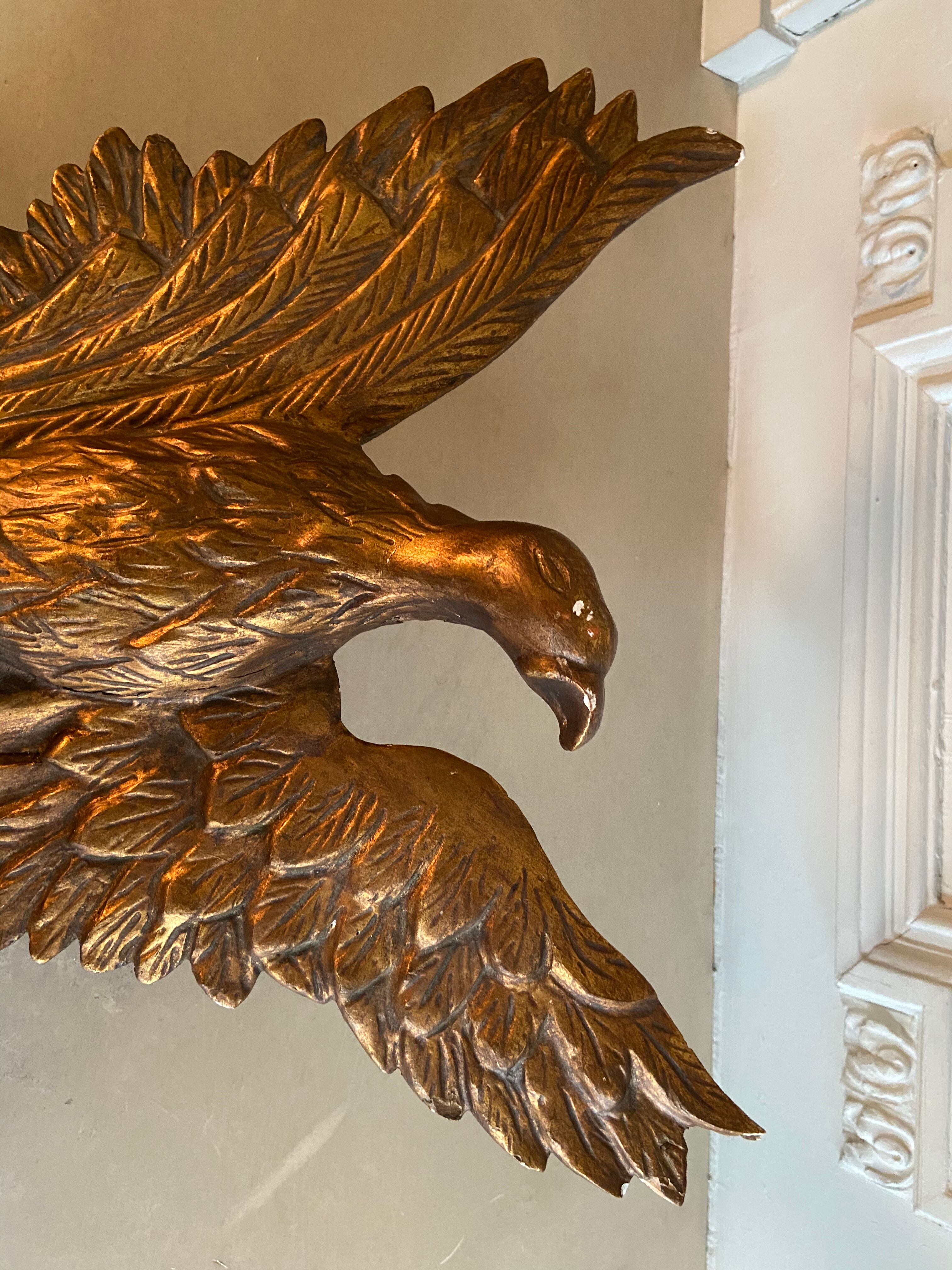 Empire gilded wooden mirror decorated with eagle  40x97cm