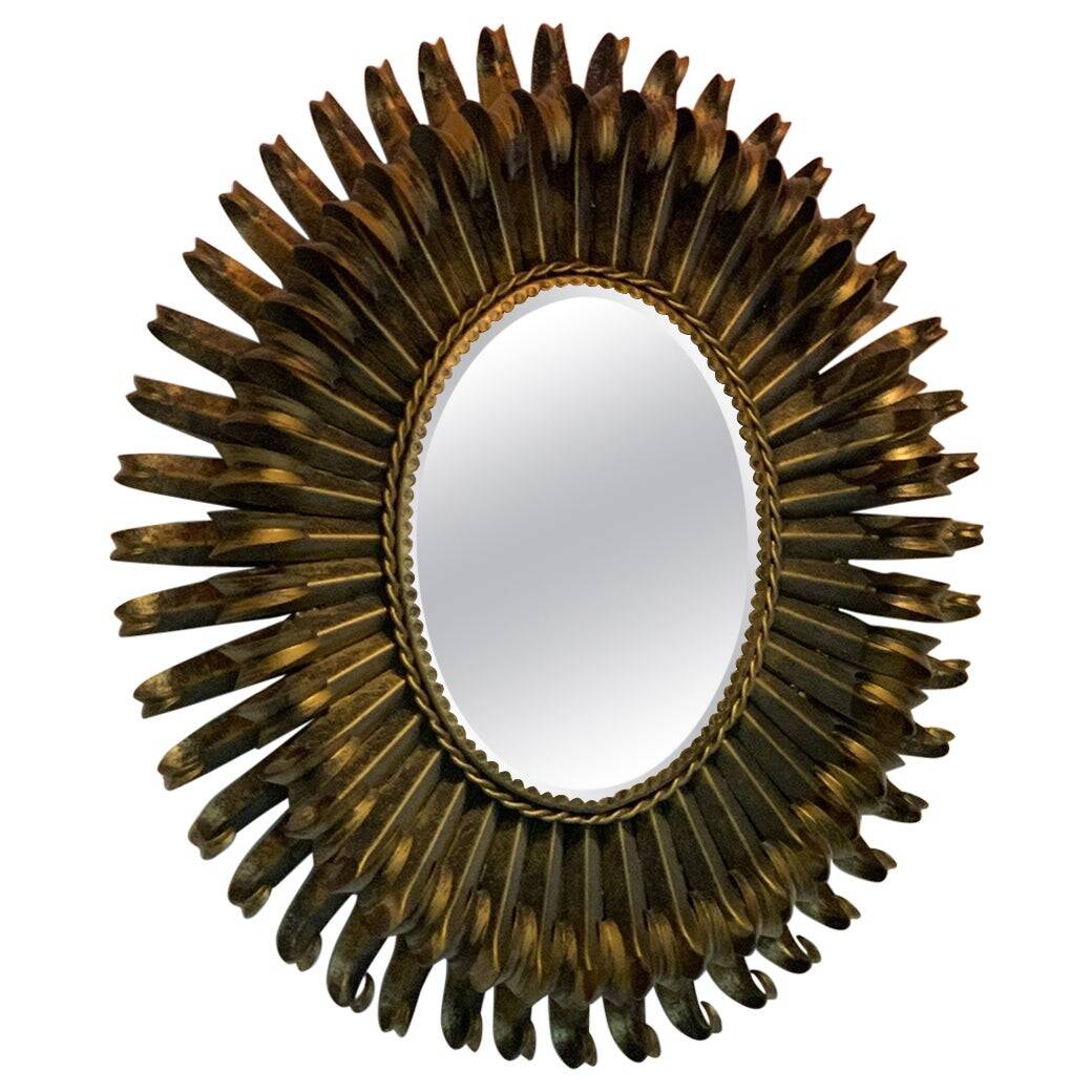 Golden iron star-shaped mirror, mid-1900s.