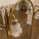Vintage triptych mirror in brass with wall lights.