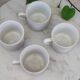 Coffee cup with floral design in porcelain