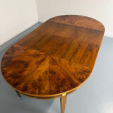 Round walnut Napoleon III extendable table with bronze top in good condition.