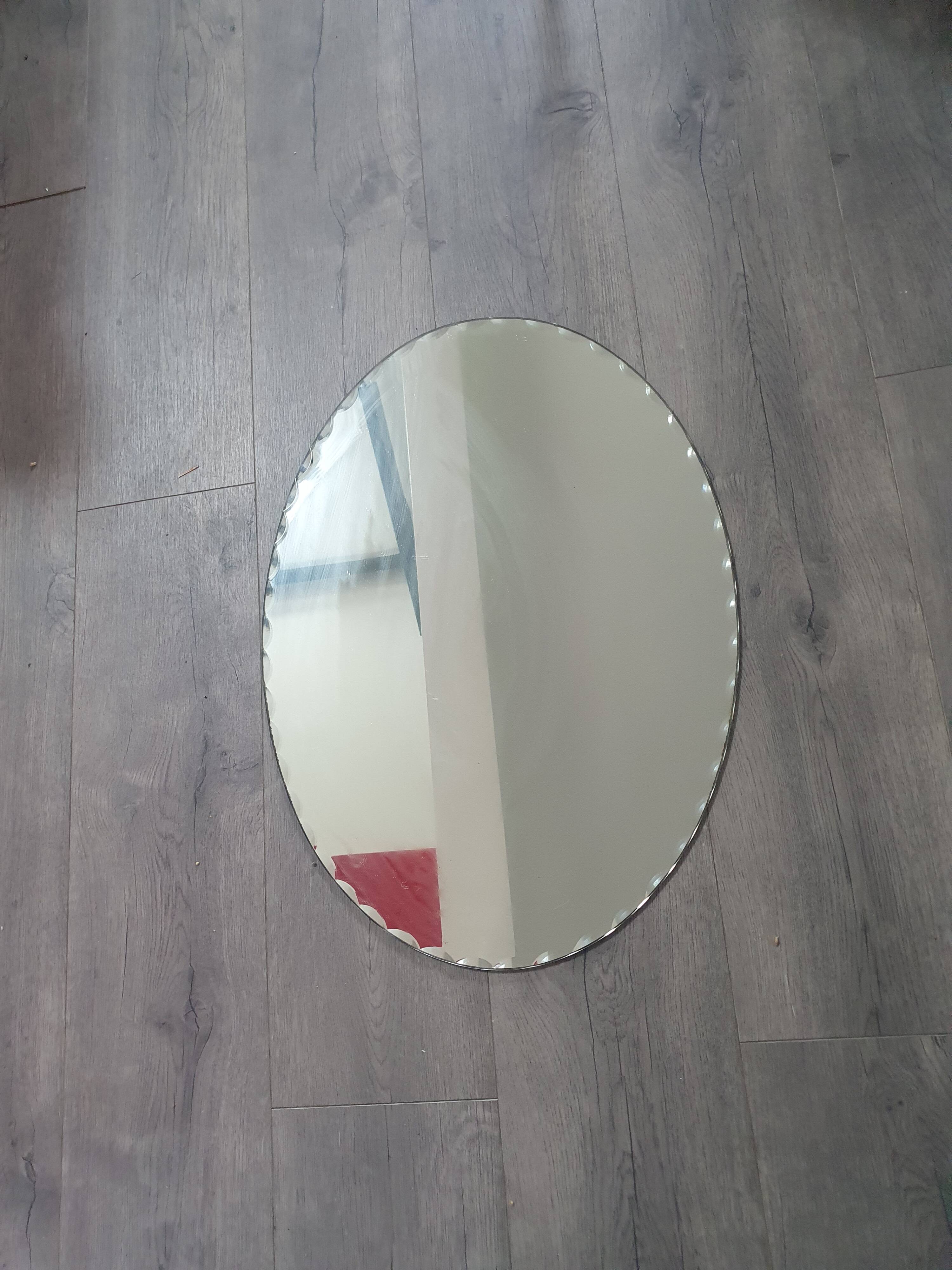 Miroir oval biseauté vintage année 60 60cm sur 42cm