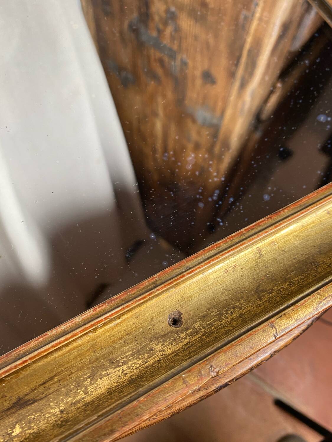 Antique mirror in gilded wood