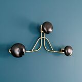 Golden brass coat rack with 3 black vintage hooks from the Mid Century 1950-60.