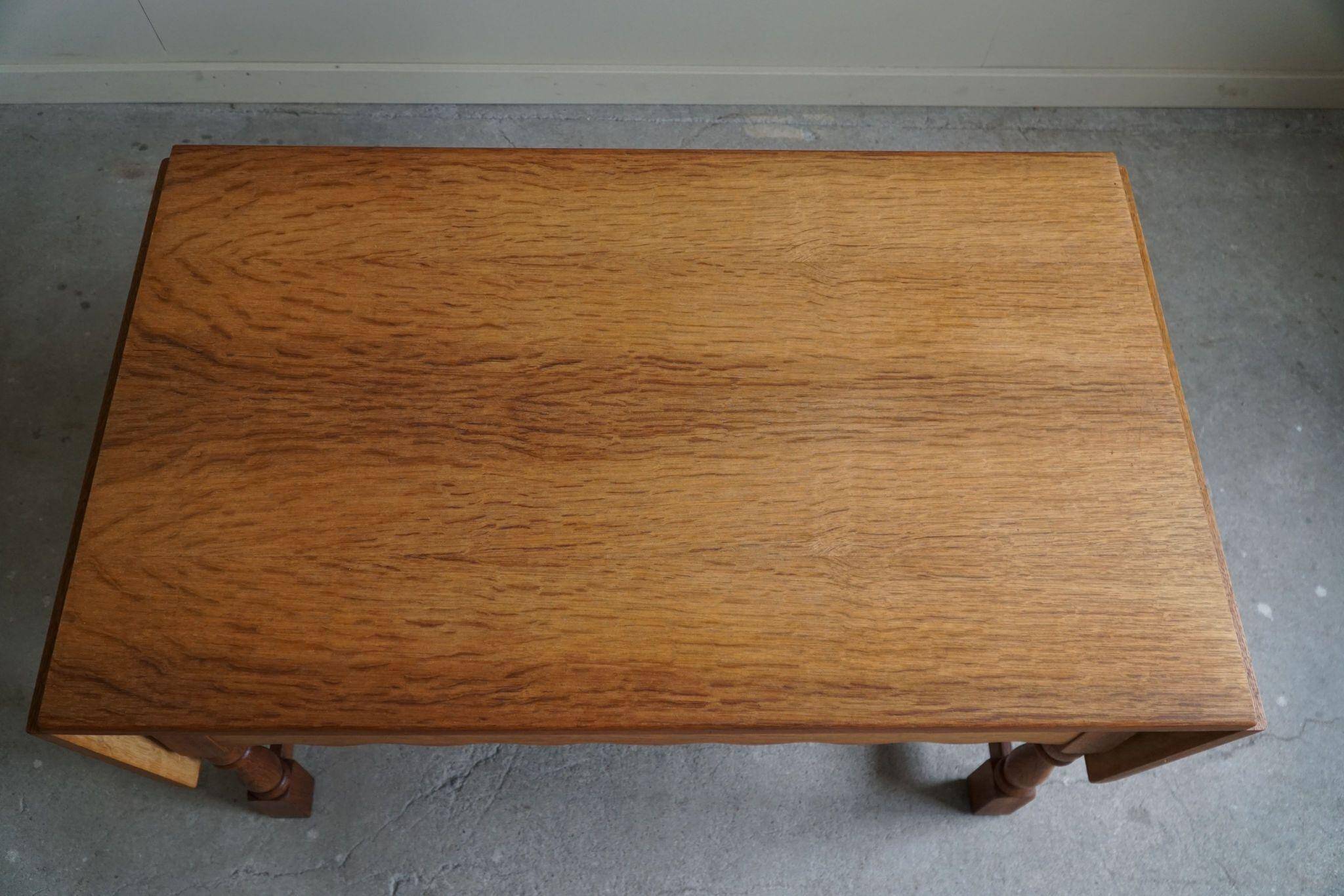 Danish folding table from the mid-century with a drawer in oak, Henning Kjærnulf, 1960s.