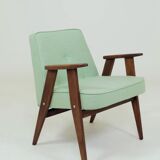 Pastel pistachio wool fabric Scandinavian armchair, oak wood.