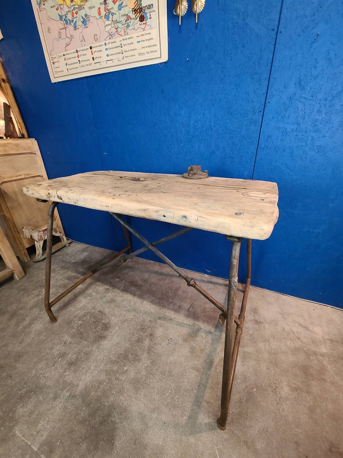 Vintage workbench circa 1930, folding metal leg.