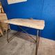 Vintage workbench circa 1930, folding metal leg.