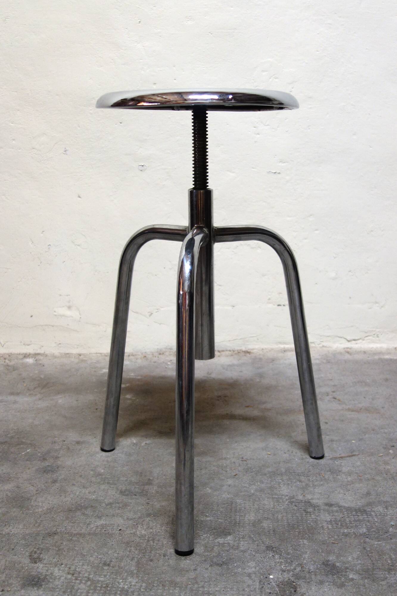 Old chrome metal swivel medical stool