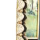 Large oval Florentine mirror in carved wood and gilded with gold leaf.