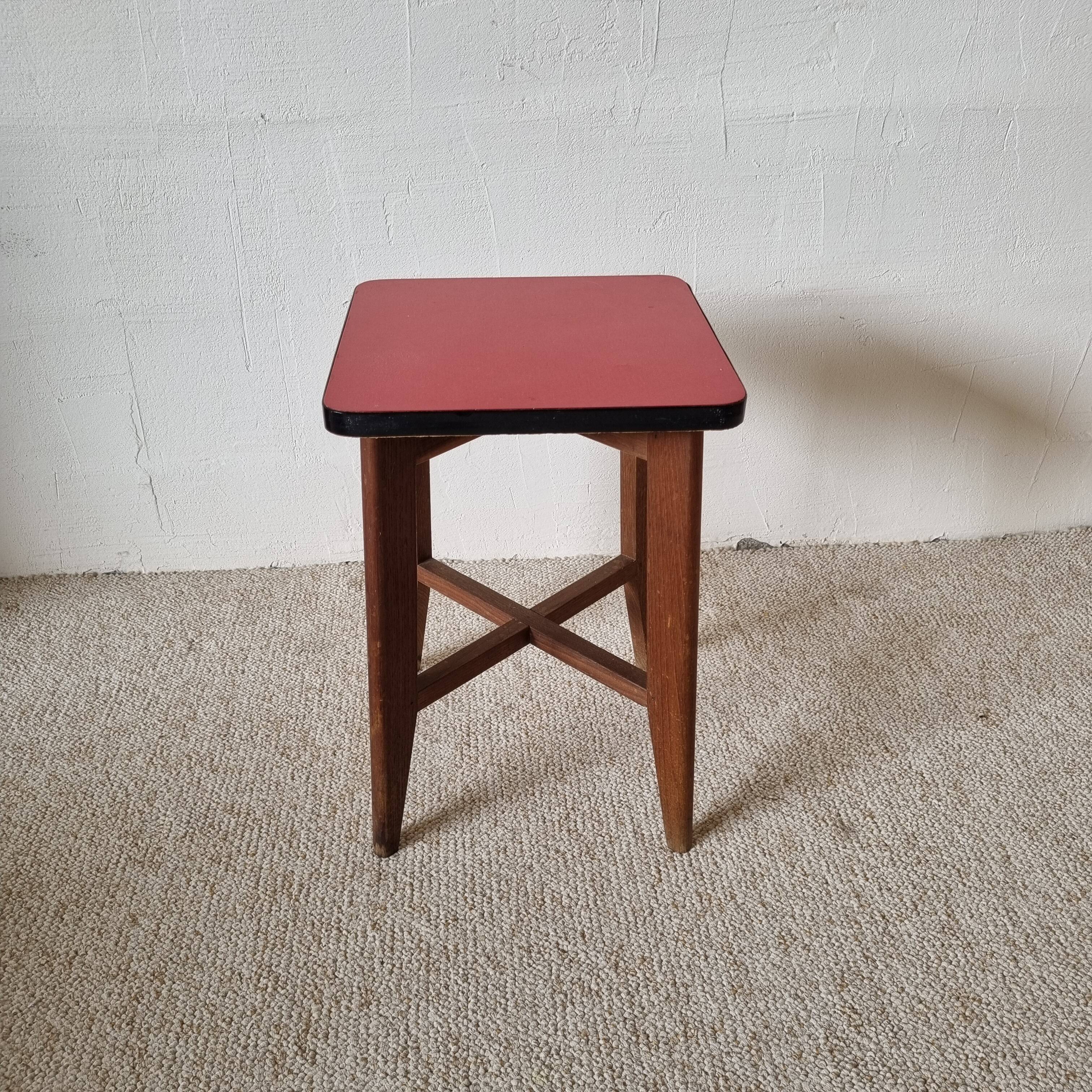 Wooden stool and red formica
