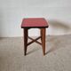 Wooden stool and red formica