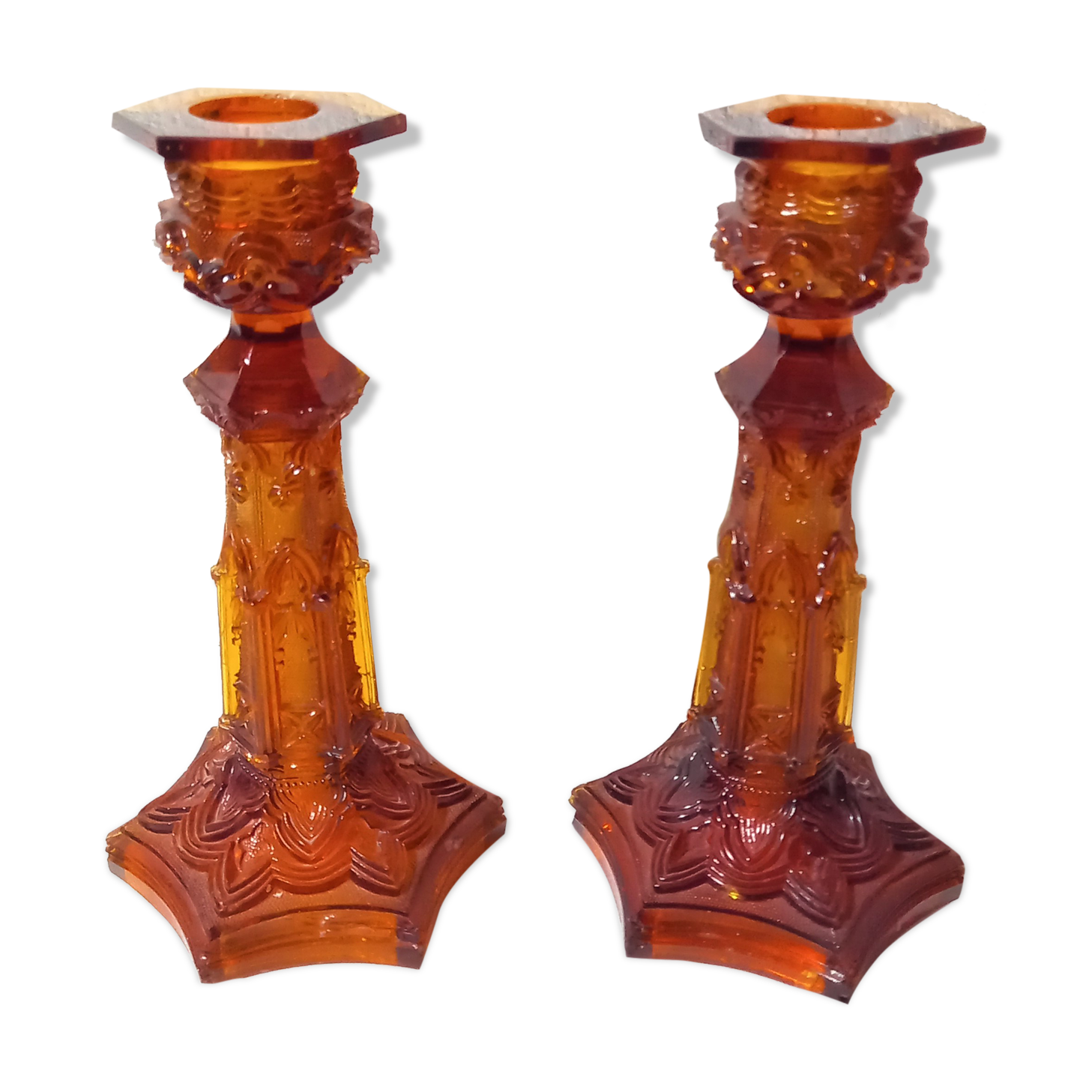 Pair of amber glass torches decorated with gothic motifs