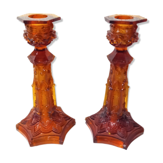Pair of amber glass torches decorated with gothic motifs