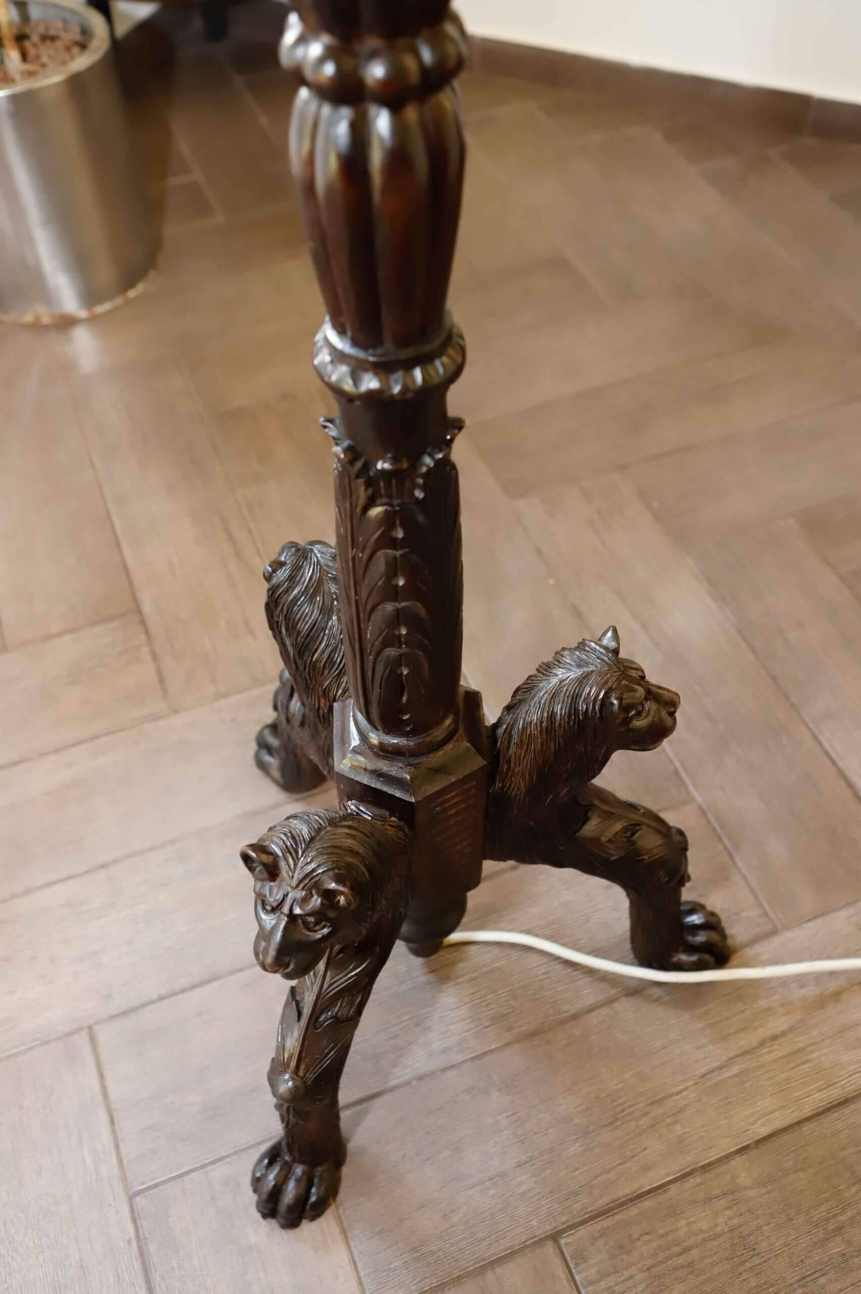 Antique floor lamp with lion motif