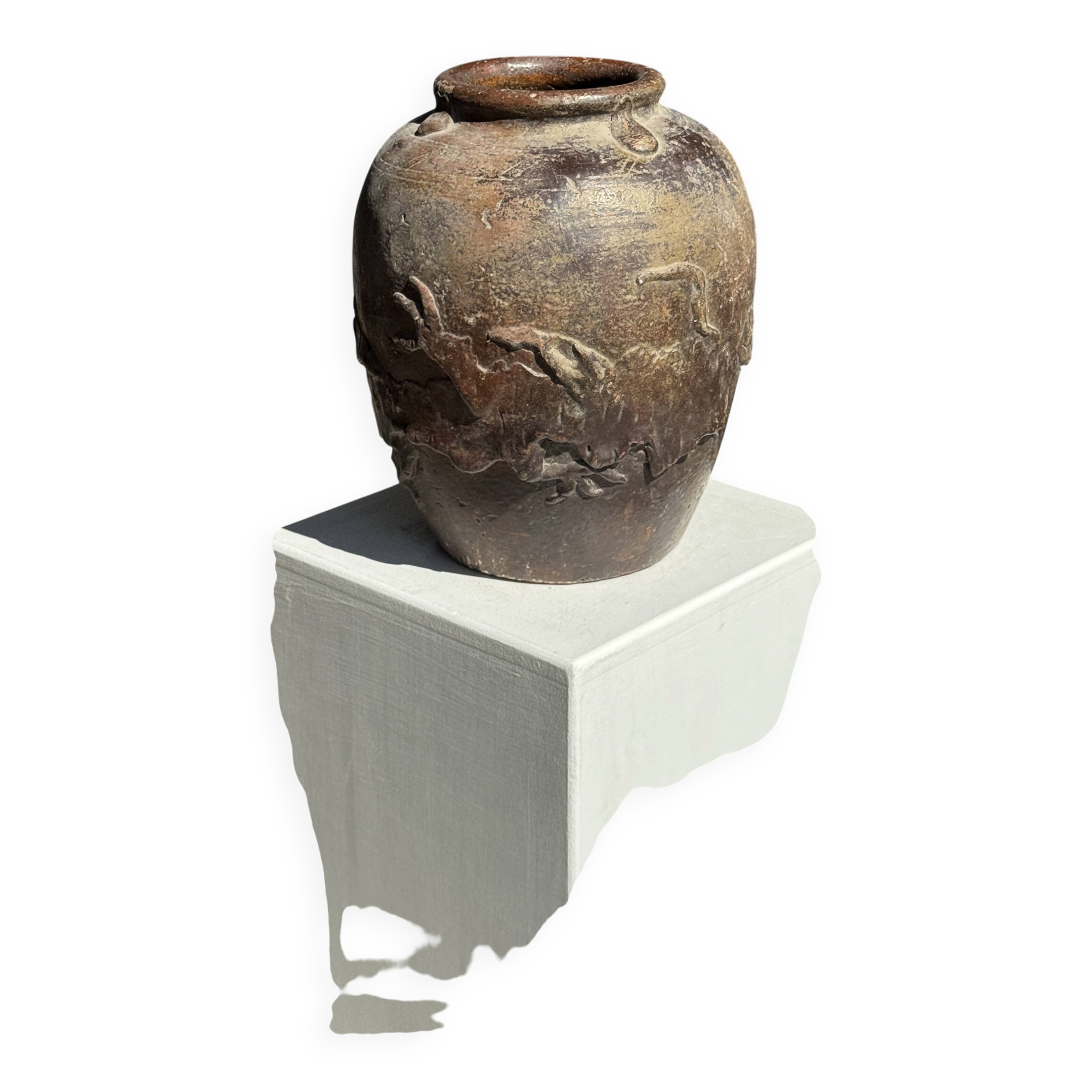 Large traditional Indonesian clay pot featuring a dragon.