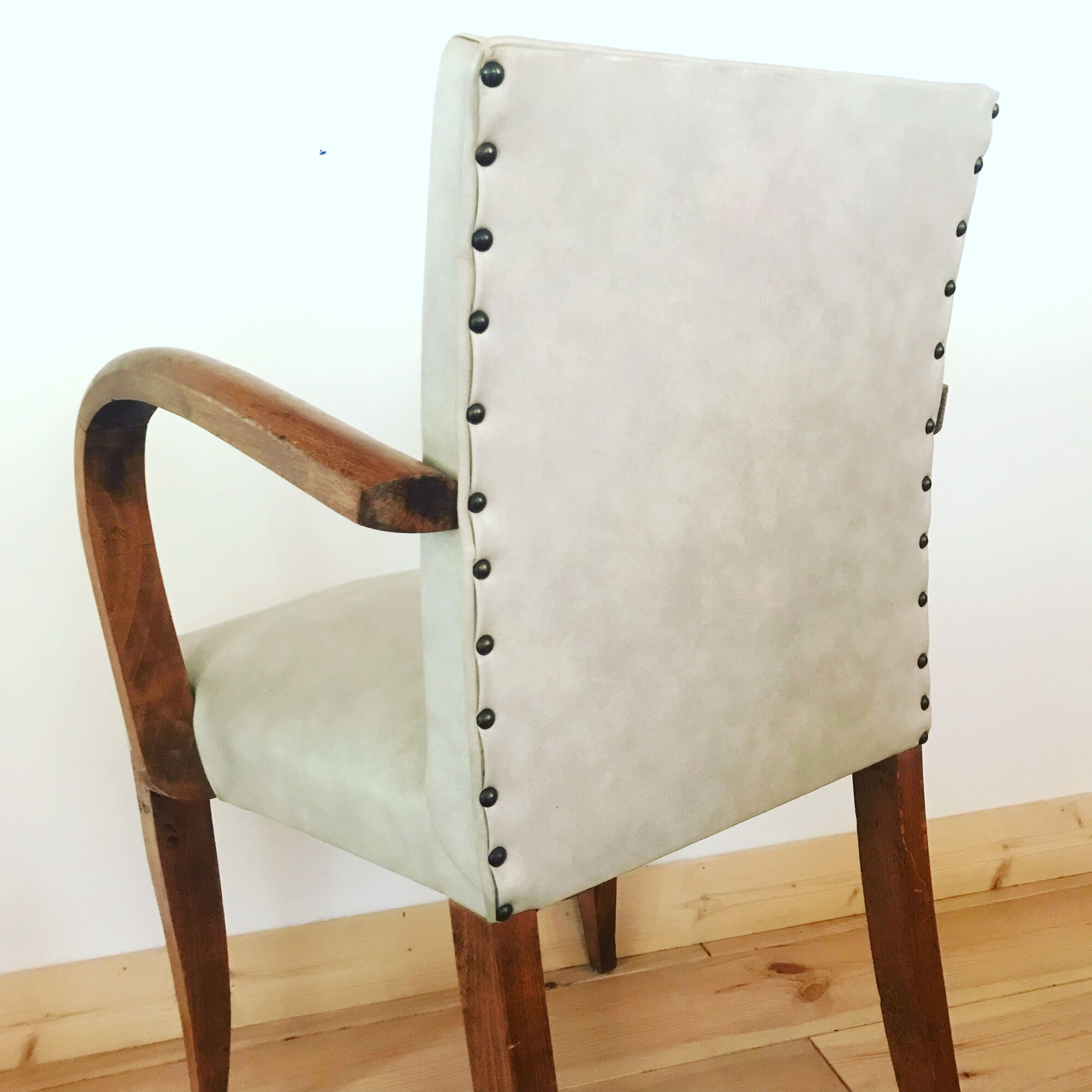 Pair of vintage armchairs in wood and imitation leather