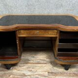 Curved Art Deco period center desk in clear magnifying glass and black lacquer circa 1925