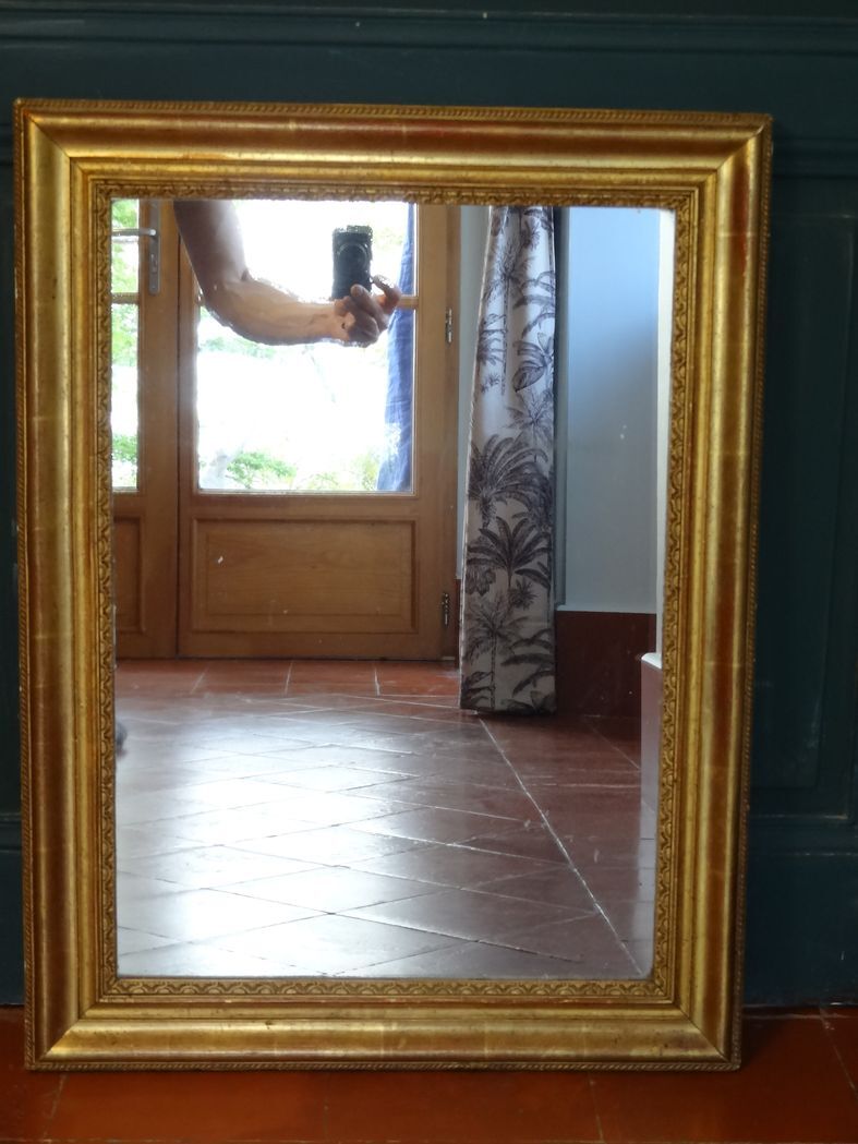 Empire period mirror, early nineteenth in gilded stucco wood H 72 cm